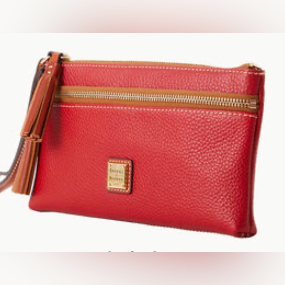 Dooney & Bourke red wristlet.  Brand new still has wrapping on it.